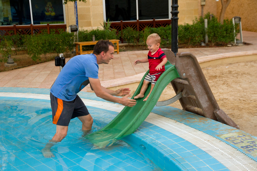 Toddler on a water slide