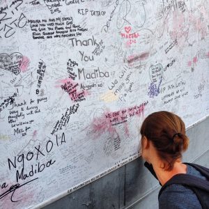 woman writing on a memory wall