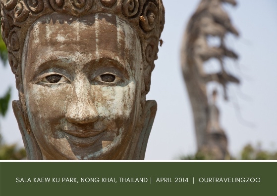 A statue of a smiling Buddha at Sala Kaew Ku Park in Nong Khai, Thailand