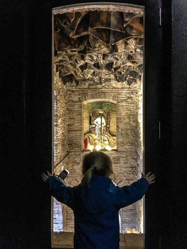 A toddler taking in an exhibit at Dali Theatre-Museum